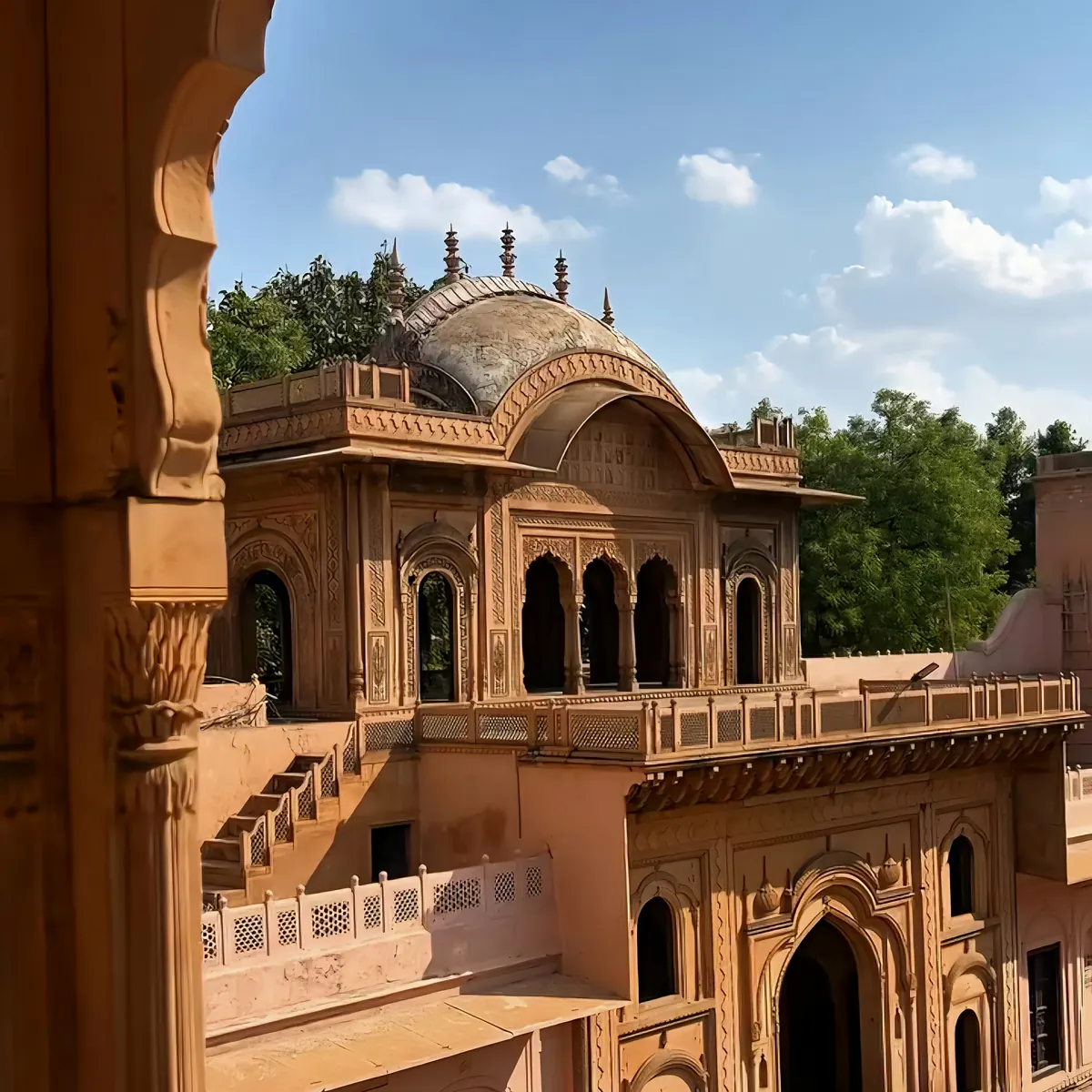 Nahar Singh Palace seen through a stone arch in Faridabad