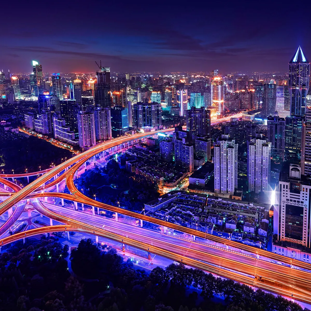 High-rise towers and roads lit at night in Gurgaon